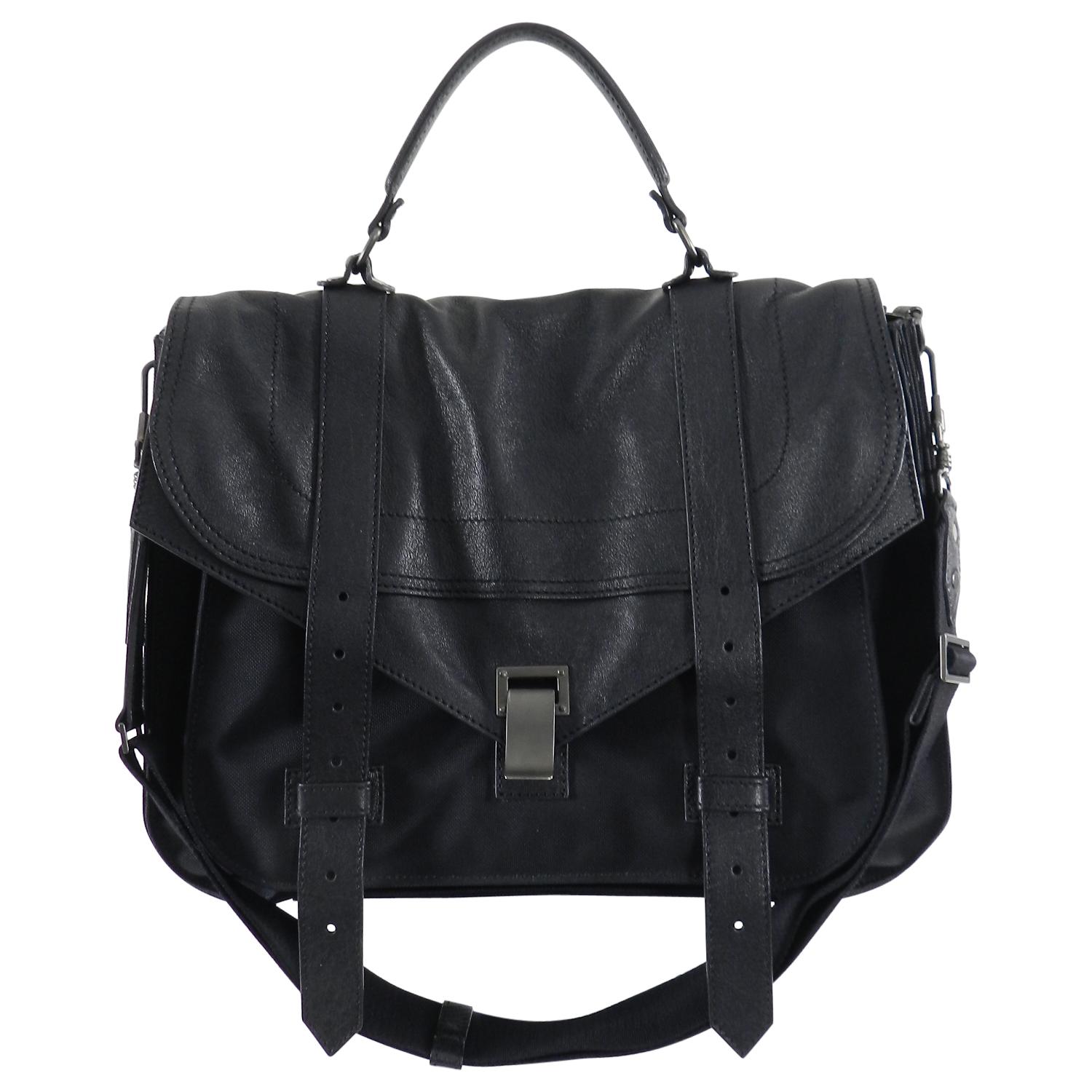 Proenza Schouler PS1 Extra Large Black Leather and Nylon Bag.  Brand new unworn with plastic still on hang tag.  Black leather with nylon body and adjustable web strap.  Dark gunmetal black hardware.  Size Extra Large PS1 measuring about 16 x 11.5 x