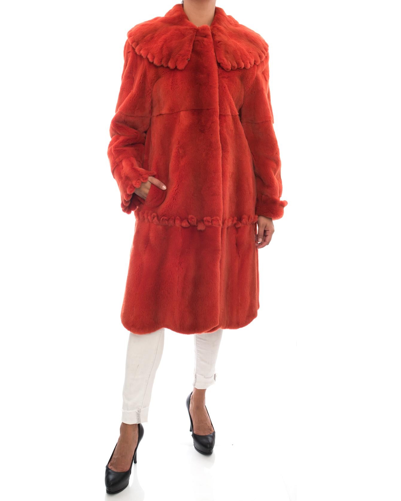 Vintage Adolfo Birger Christensen Burnt Orange Sheared Mink Fur Coat.  Swing style design with wide Peter Pan collar. Scalloped design at cuffs, collar and across hip.  Side slit pockets on seam. Will fit USA 10. Garment bust measures 44” and is