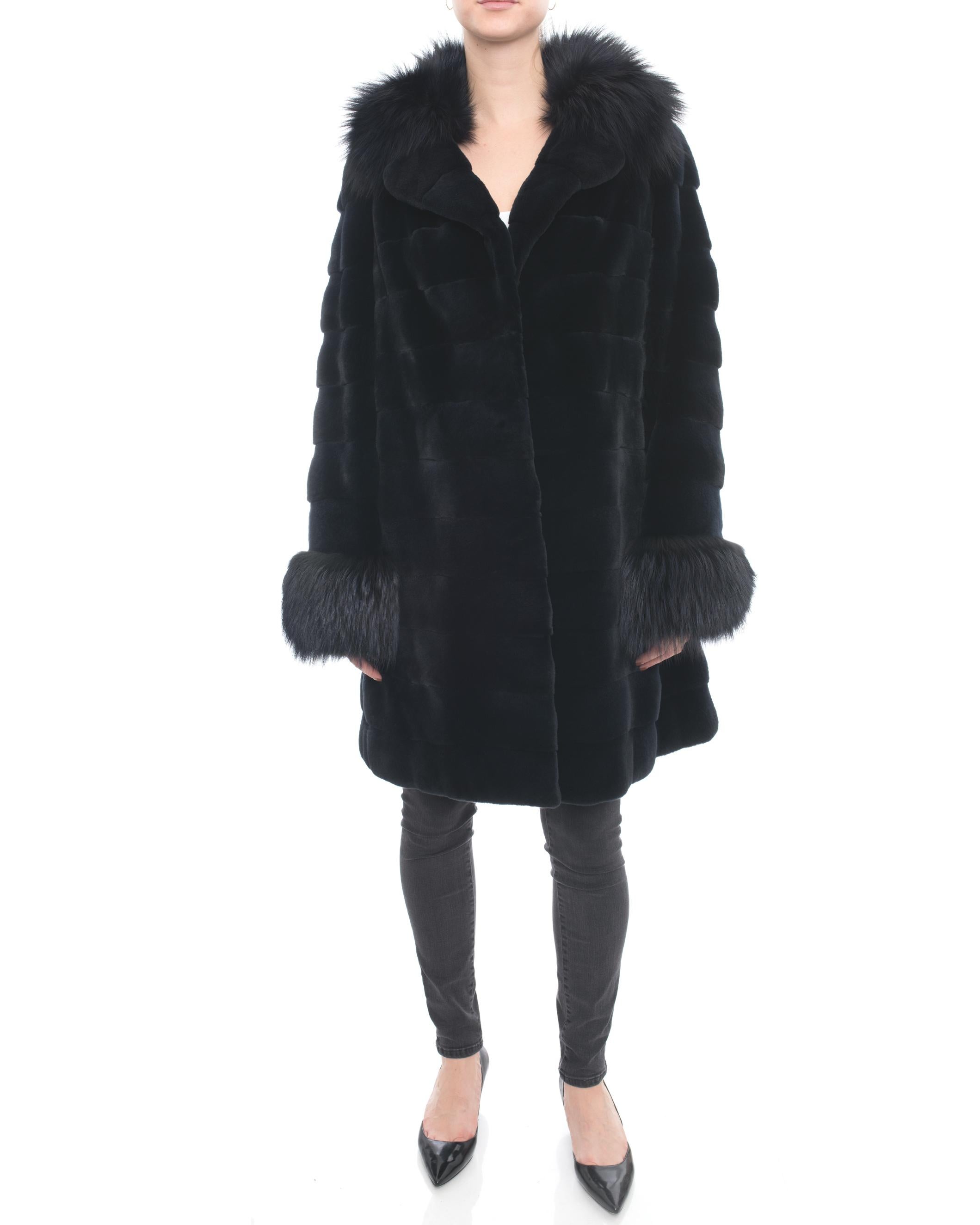 Holt Renfrew Midnight Sheared Mink and Fox Fur Trim Coat.  Original retail $5500+. Colour is a very dark midnight navy that appears close to black. Fastens with hook closures at front, side pockets on seam, 100% silk lined.  Marked size USA 12. 