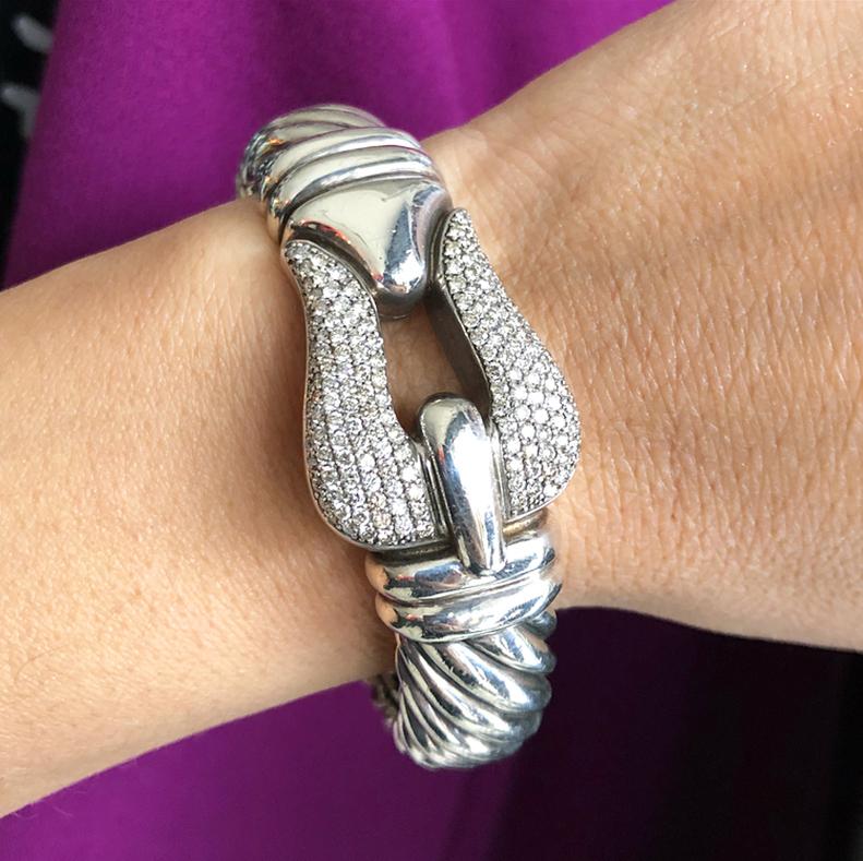 David Yurman Sterling and Pave Diamond 15mm Cable Buckle Bracelet.  Hinged bangle with pave diamond buckle and sterling body.  From the Cable Buckle Collection.  Approximate original retail $5450 USD.  Bracelet is 15mm wide and buckle is 25mm wide. 