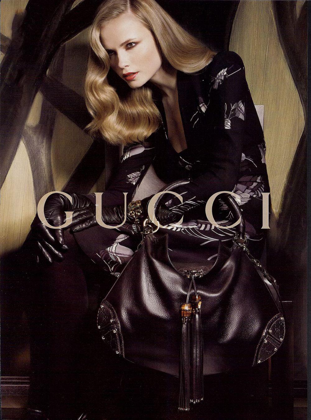 Gucci Brown Leather Indy Hobo Large Bag with Bamboo Tassels.

Iconic discontinued Gucci bag from the Fall 2007 collection.  The bag was featured in the ad campaign. Structured hinged top handle with gold metal logo plate,  fold-over closure with