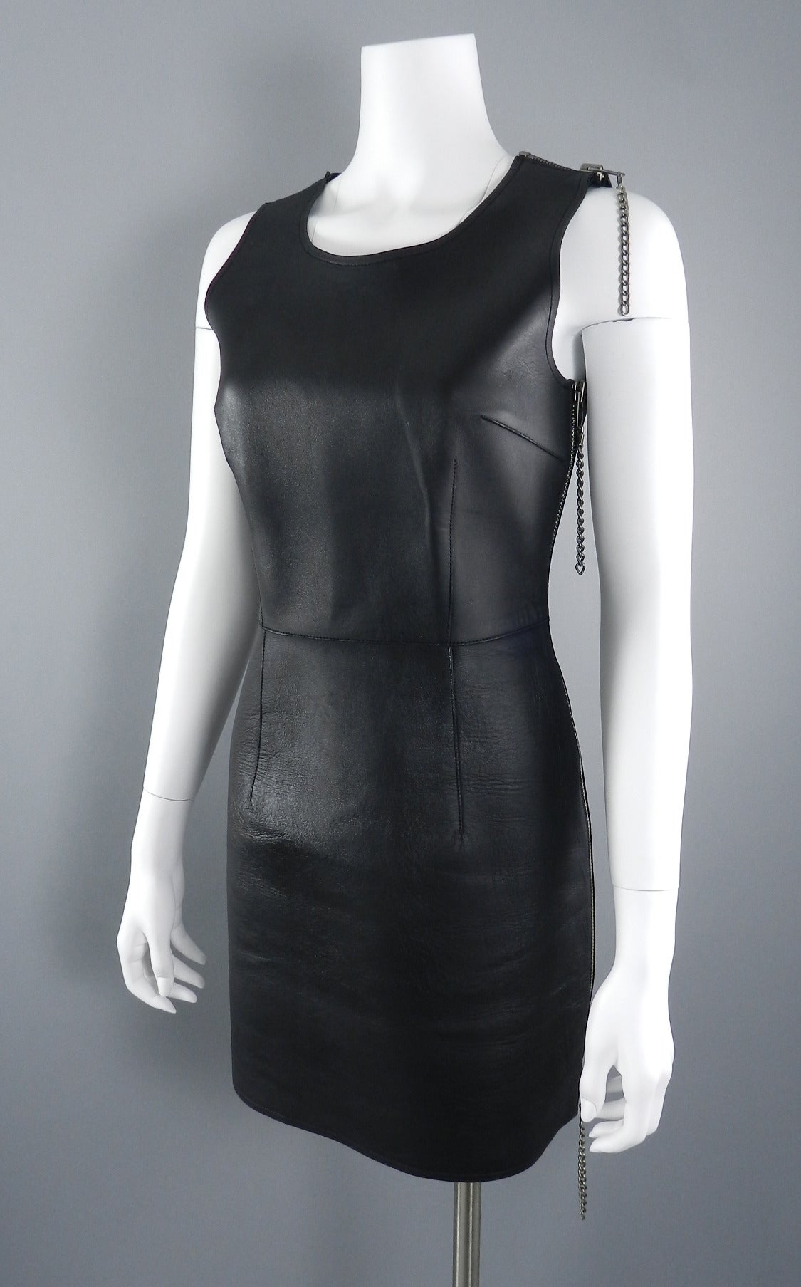 Maison Martin Margiela black leather tank dress with metal zipper at left side and shoulder. Tagged size IT 42 (USA 6). To fit 34