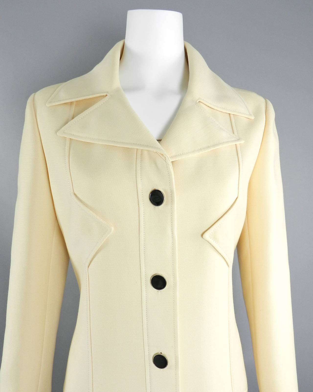Vintage early 1970's Pierre Cardin cream wool coat. Excellent clean condition with no marks on the wool. Garment measures 39