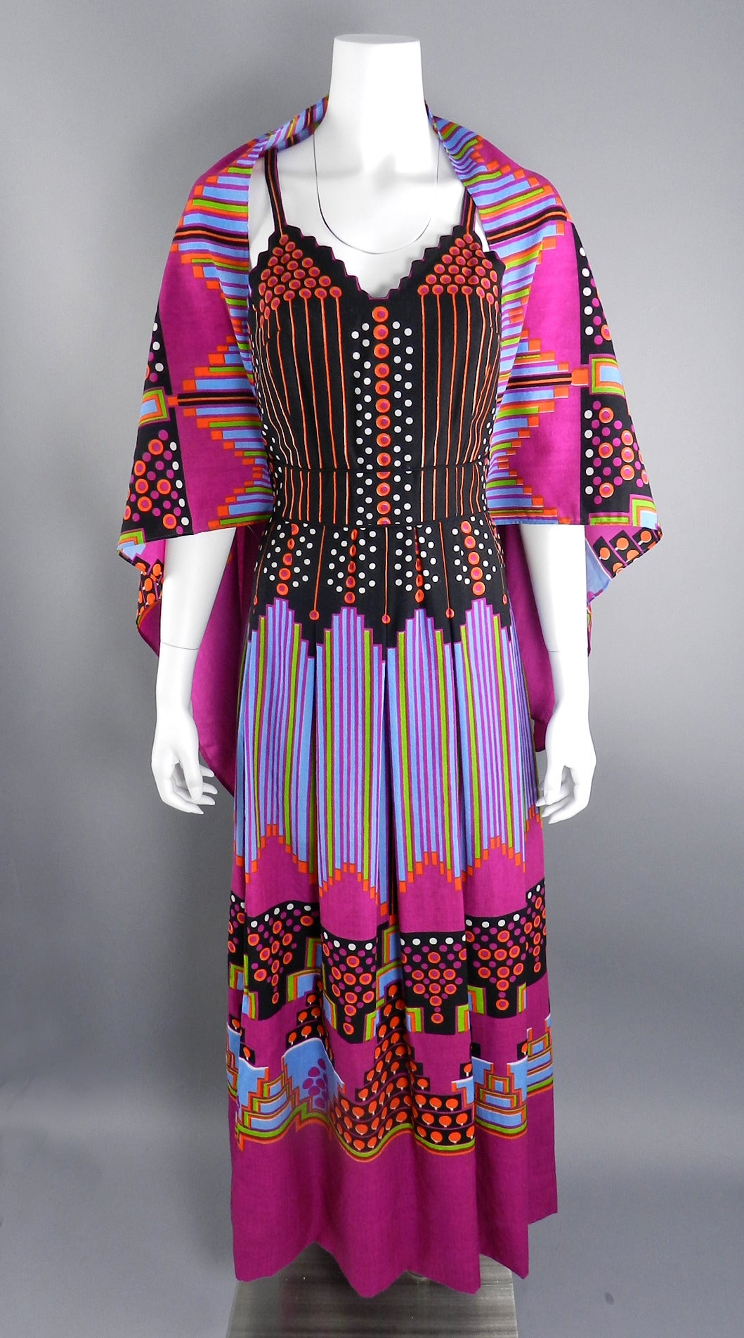 Vintage 1972 Lanvin black label dress with bold graphic pattern. The neckline is scalloped and the back covered buttons line up with the circular pattern. Matching shawl. Excellent clean condition. Tagged size vintage 12 (about a modern USA 8). Bust