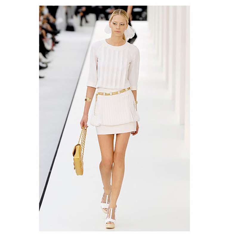 Chanel Spring 2007 runway and ad campaign dress. Ivory with vertical pleats, 3/4 sleeves, fastens with buttons and zipper at centre back. Tagged size Chanel 38 (USA 6). To fit 34