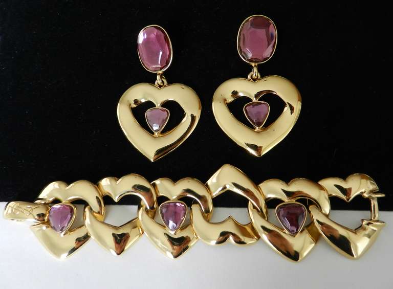 Vintage 1990's Yves Saint Laurent - YSL purple heart bracelet and earrings set. Excellent condition and with original box. Signed YSL on all pieces. Bracelet is 7