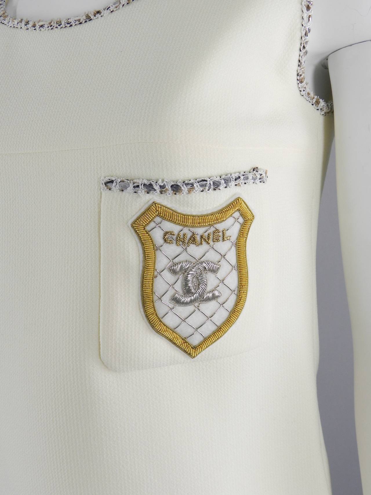 Chanel 2005 Cruise collection white tank top with CC crest design. Has a hidden side zipper and goes on over the head and shoulders. Excellent condition. Tagged size FR 38 - USA 6. To fit 34