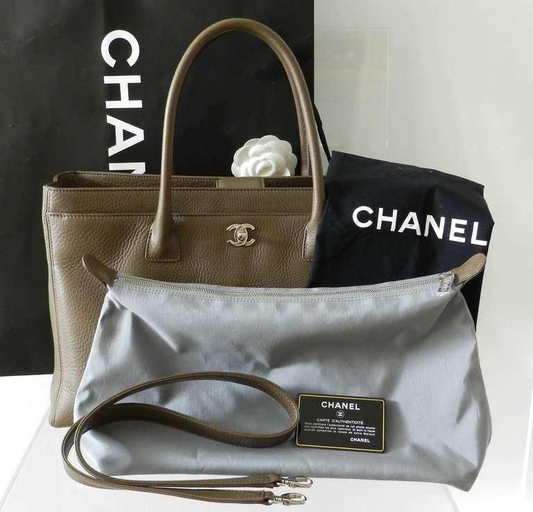 Chanel Cerf Tote bag in the XL size from current season! (serial number is 18 - series). Has only been used once and still has protective plastic on some of the interior zipper pulls. Color is a cappuccino brown. Comes with original shoulder strap,