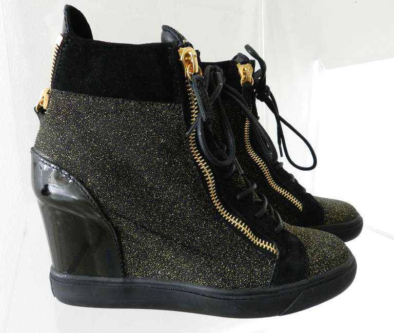 Giuseppe Zanotti gold glitter Lorenz platform wedge sneakers. Size 41. Made in Italy. Gold metal zippers and tongue plate plaque. Suede, patent leather, and gold glitter. Excellent previously owned condition - probably only worn once.

Shipping