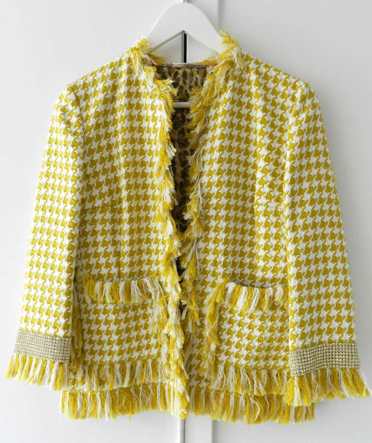Dolce & Gabbana yellow and white cotton houndstooth jacket. Wide band of real Swarovski crystal rhinestones at cuffs, sheer leopard silk lining, fastens with 3 hook and eye closures at front. Tagged size IT 38 (USA 4). Excellent condition. To fit