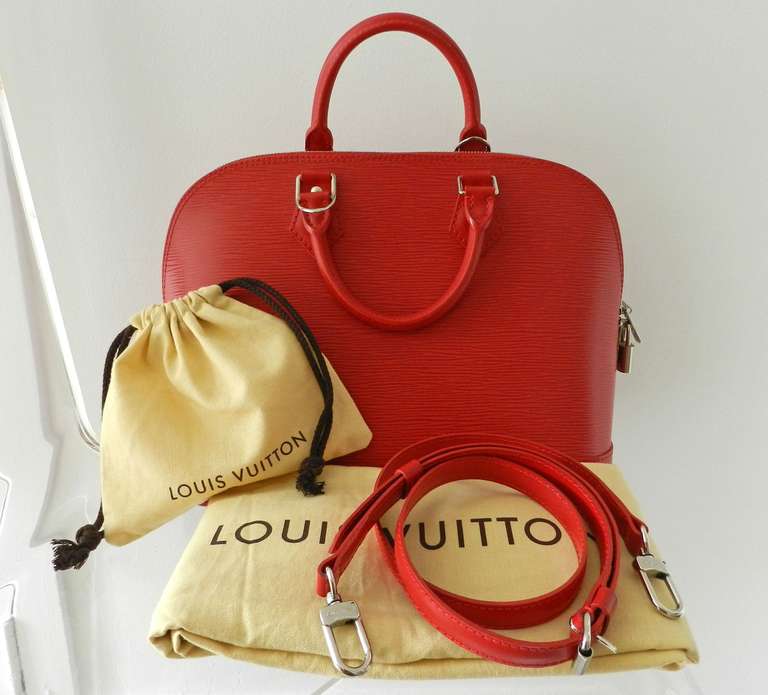 Louis Vuitton red Epi Alma PM with strap. Silvertone hardware. Excellent condition - used once. Body measures 9.5 x 14 x 6.25