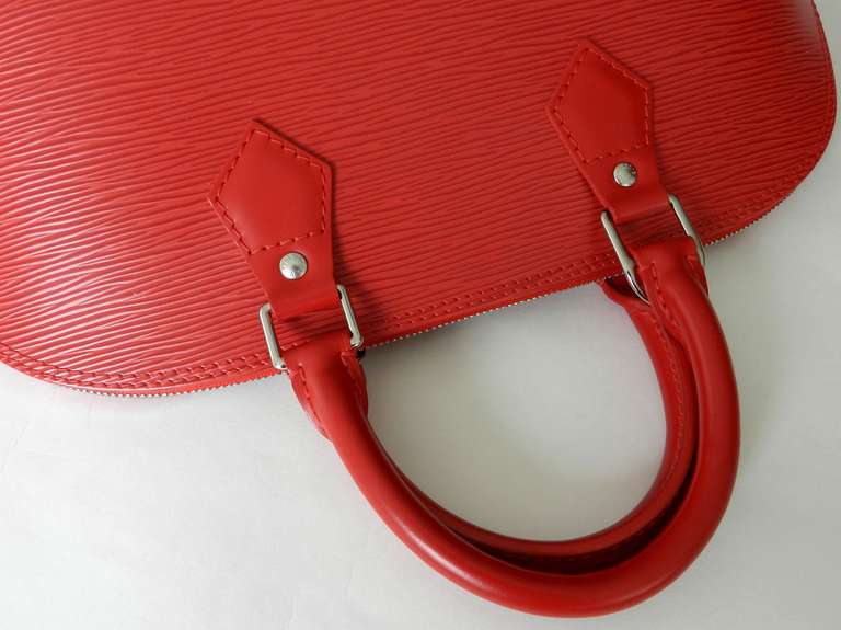 Louis Vuitton Red Epi Alma PM with Strap In Excellent Condition In Toronto, ON