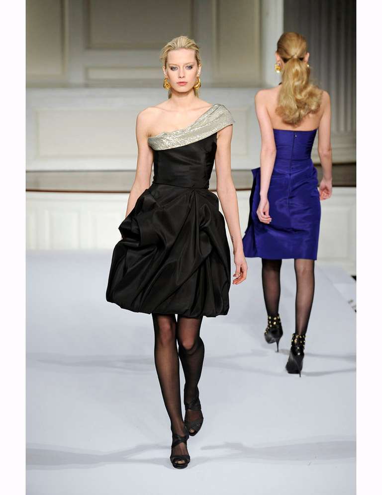 Oscar de la Renta pre-fall 2009 runway black cocktail dress with gold and silver metallic lamay neckline. One shoulder design with interior corset. Tagged size 4. To fit 33