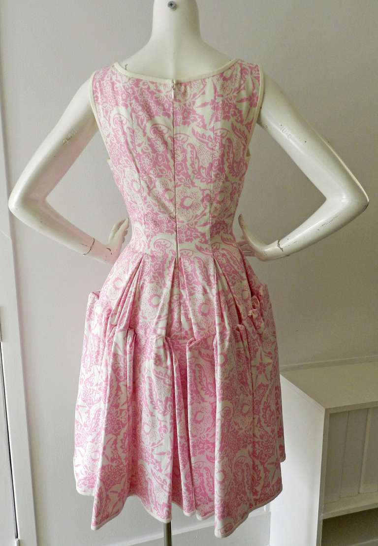 Oscar de la Renta pink and white cotton dress. Sleeveless, dropped waistline, full skirt, centre back zipper. Excellent condition. Tagged size 8 but is like a 6/8. To fit 34/35