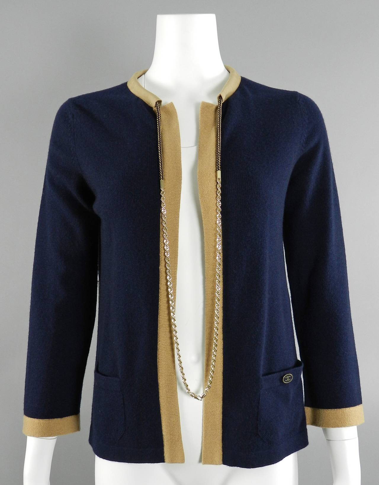 Chanel 11P navy and camel cashmere cardigan with gold chain. Excellent condition - worn once if at all. 100% cashmere. Tagged size Chanel 38 (about USA 6). Garment measures 36