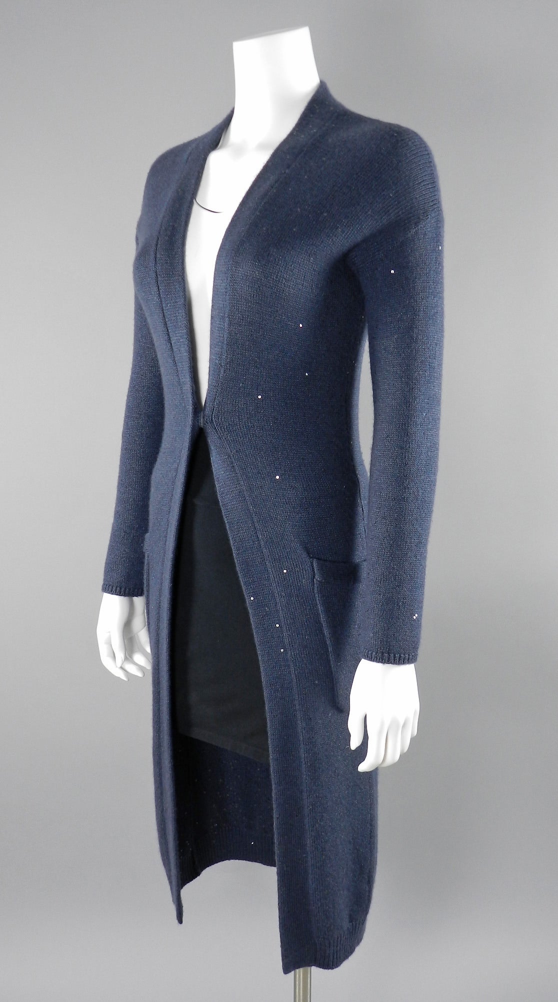 Brunello Cucinelli periwinkle greyish blue cashmere long cardigan sweater. Decorated with small sequins for a slight shimmer effect. Snaps closed at centre front and has a gap across front (shown with black skirt underneath).  Excellent condition.