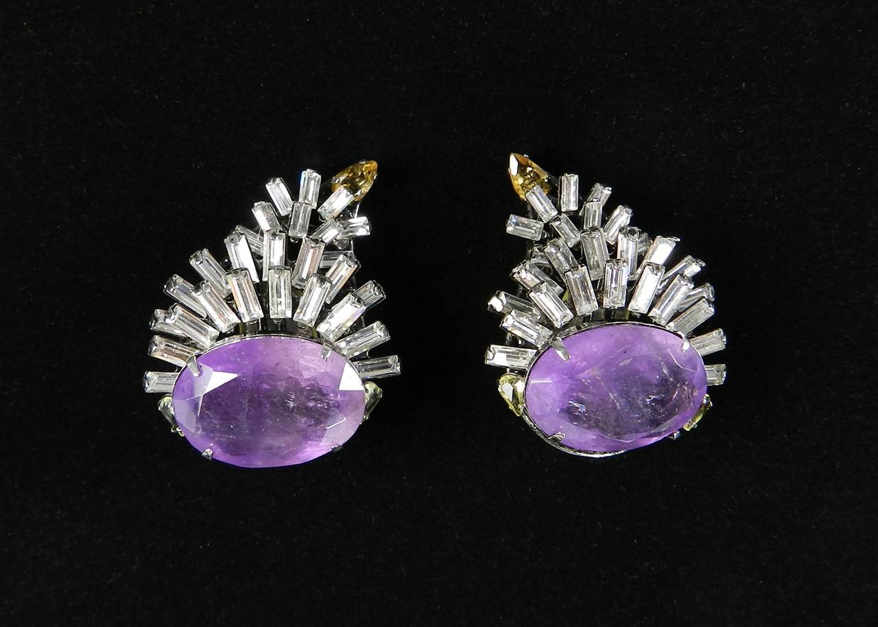 Iradj Moini clip earrings. Clear rhinestones, amethyst, citrine, and topaz. Signed on the back clip. Excellent condition. 1.75