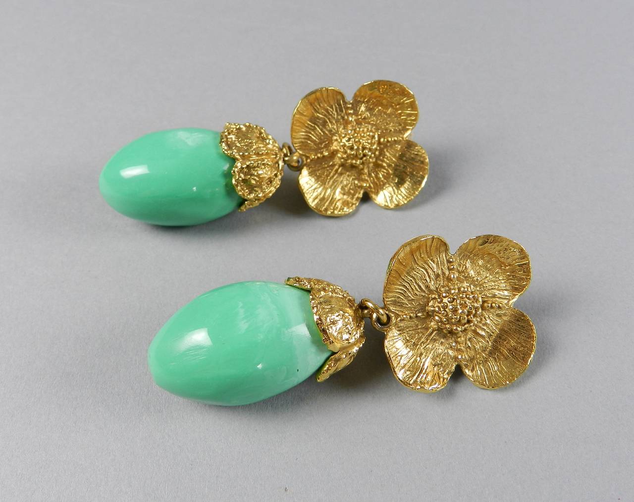 Vintage circa 1980's YSL Yves Saint Laurent mint green resin and gilt floral drop earrings. Clip on. Excellent vintage condition. Measures 2.5