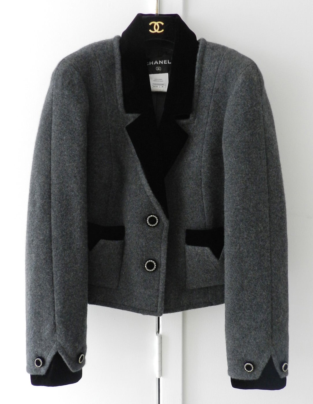 Chanel 2013 grey cashmere jacket / coat with black velvet collar and inset. Unworn condition. With tags and original price of $6650+. Size Fr 38 (USA 6).

Shipping prices provided are for trackable ground shipping to the USA. For Canada,