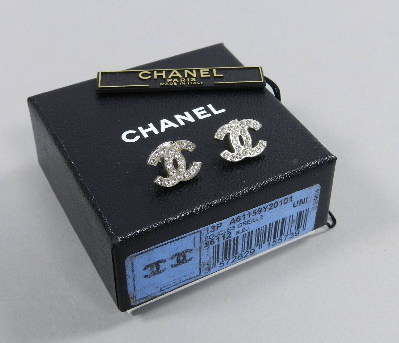 Chanel 13P silvertone CC rhinestone stud earrings. Earrings measure 0.5