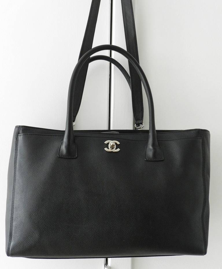 Chanel black leather cerf tote bag with silvertone hardware. Excellent previously owned condition. No original card or duster. 

Shipping prices provided are for FedEx Ground to the USA. For Canada, International, or faster priority USA shipping,