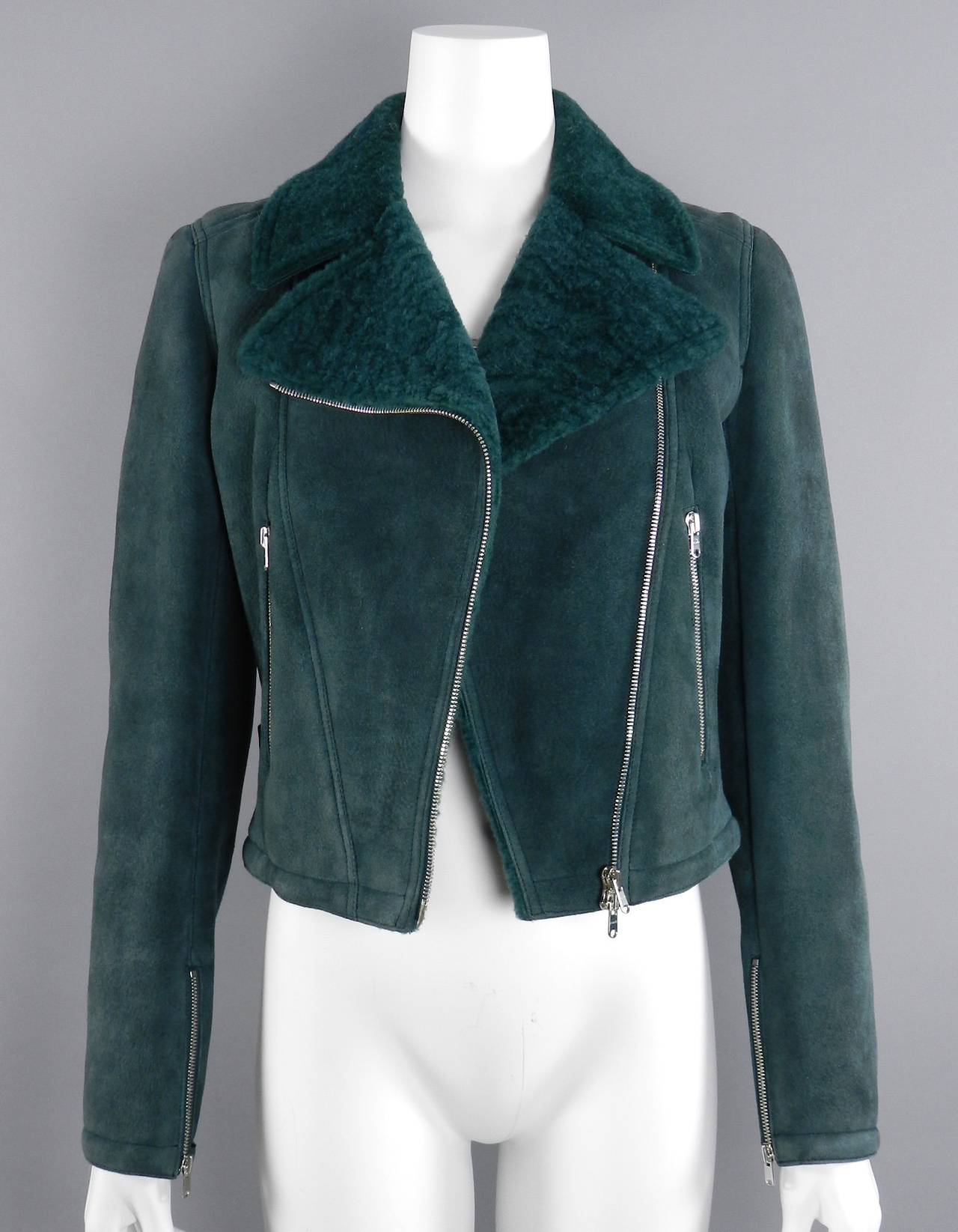 Alaia dark green shearling motorcycle crop jacket. Silvertone zippers.  Excellent pre-owned condition - worn once.  Tagged size Alaia 40 which is about a USA 8 but please note that  Alaia runs small and this will fit a USA 4 / 6 and no larger.