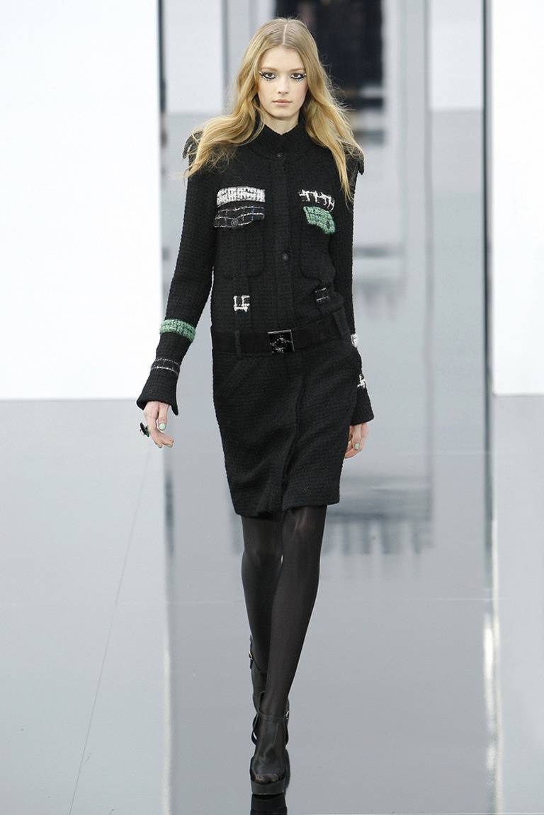 Chanel 2009 Fall runway coat/dress. Black body with white and green accents. Dropped waist has a wide black suede belt with square buckle. Excellent clean condition - worn only a few times. Tagged size 38FR (USA 6). To fit 34