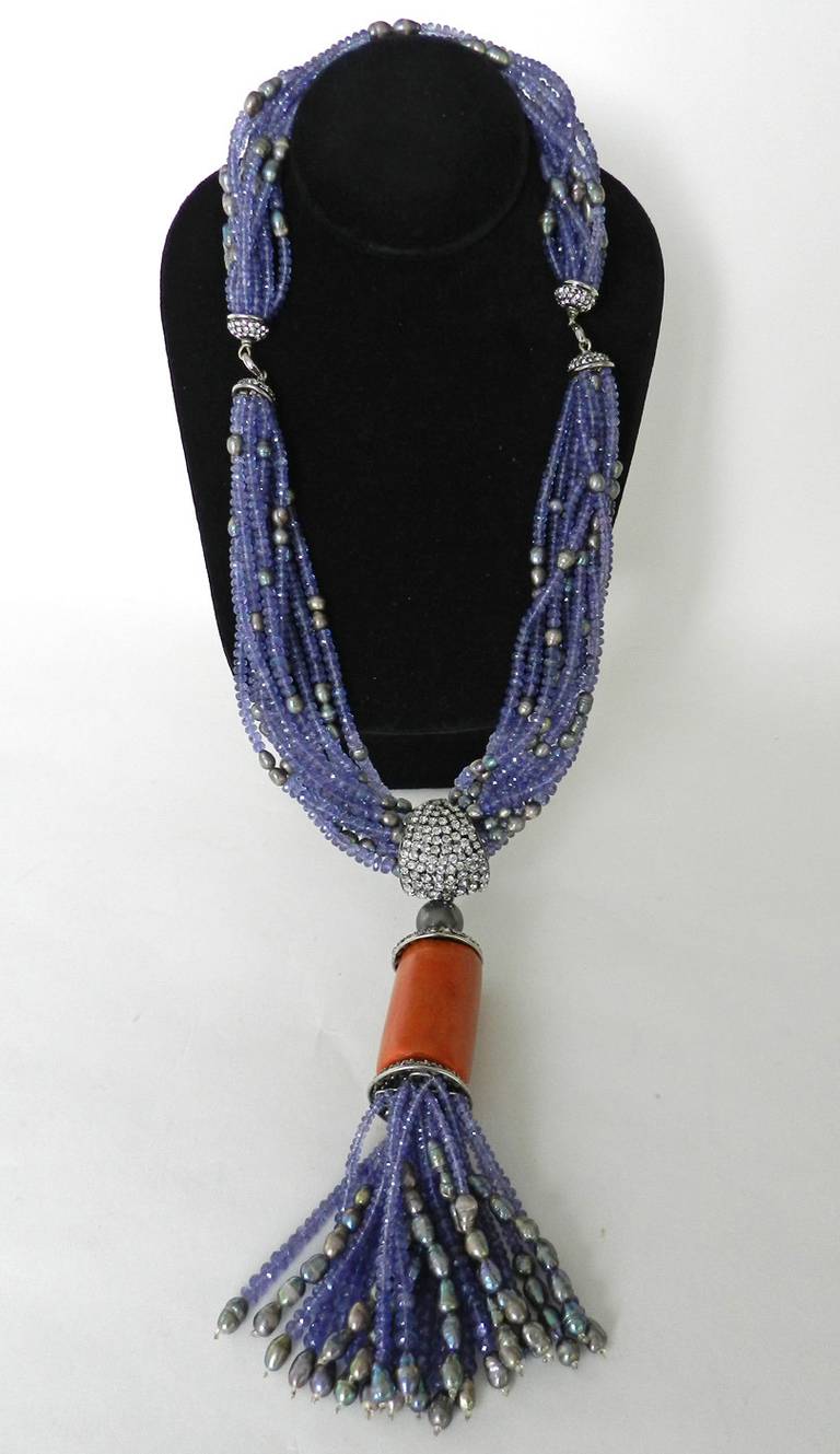 Iradj Moini amethyst beaded lariat necklace. Black pearls, rhinestones, and coral colored drop. One section of the necklace can be detached to wear at a shorter length. Item is unsigned but original owner recalls that it is Iradj Moini. Comes with