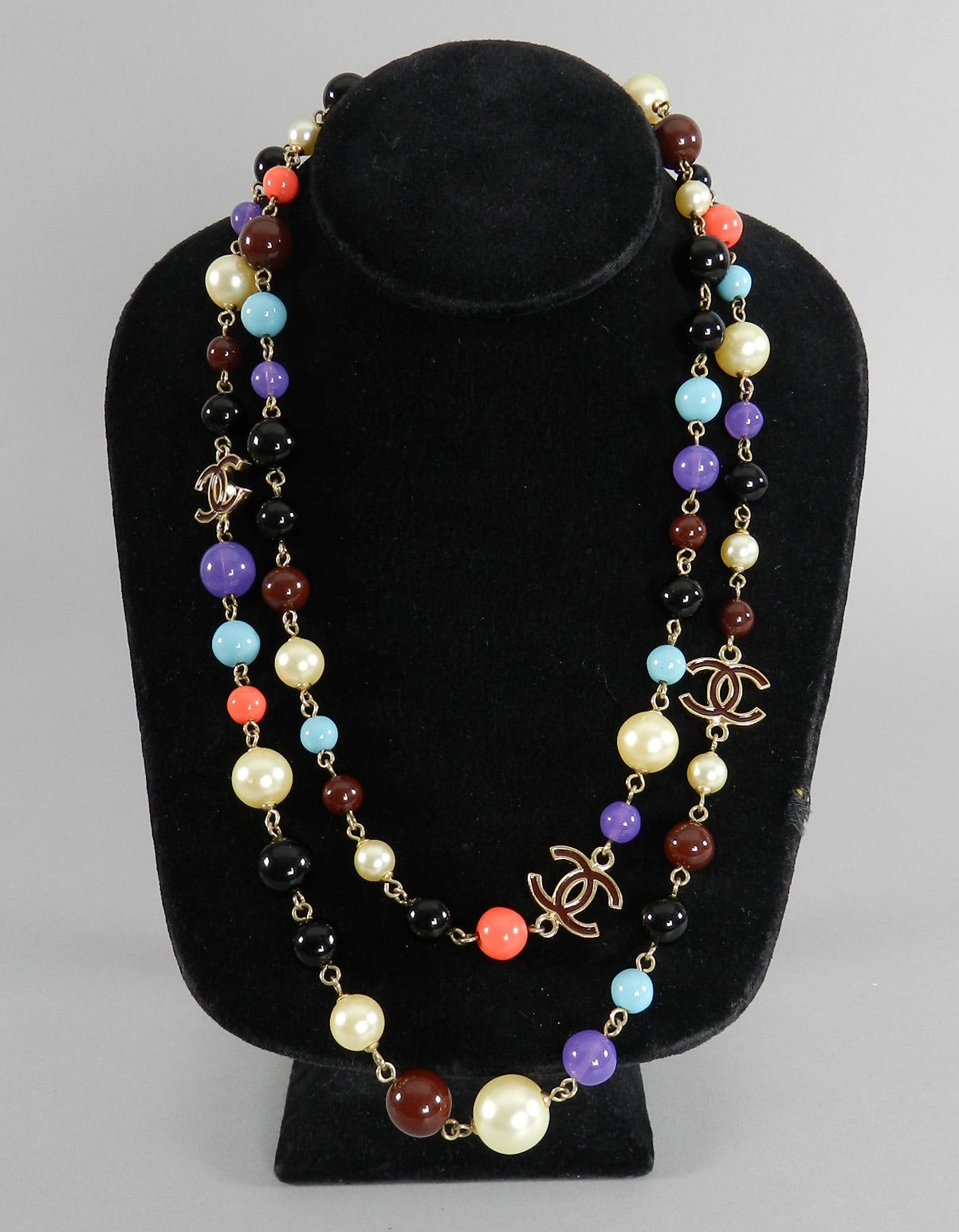 Chanel 2007 Fall runway collection glass beaded necklace. Turquoise, faux pearl, purple, black, coral, and burgundy colored beads.  Goldtone metal. Excellent condition. Measures 20