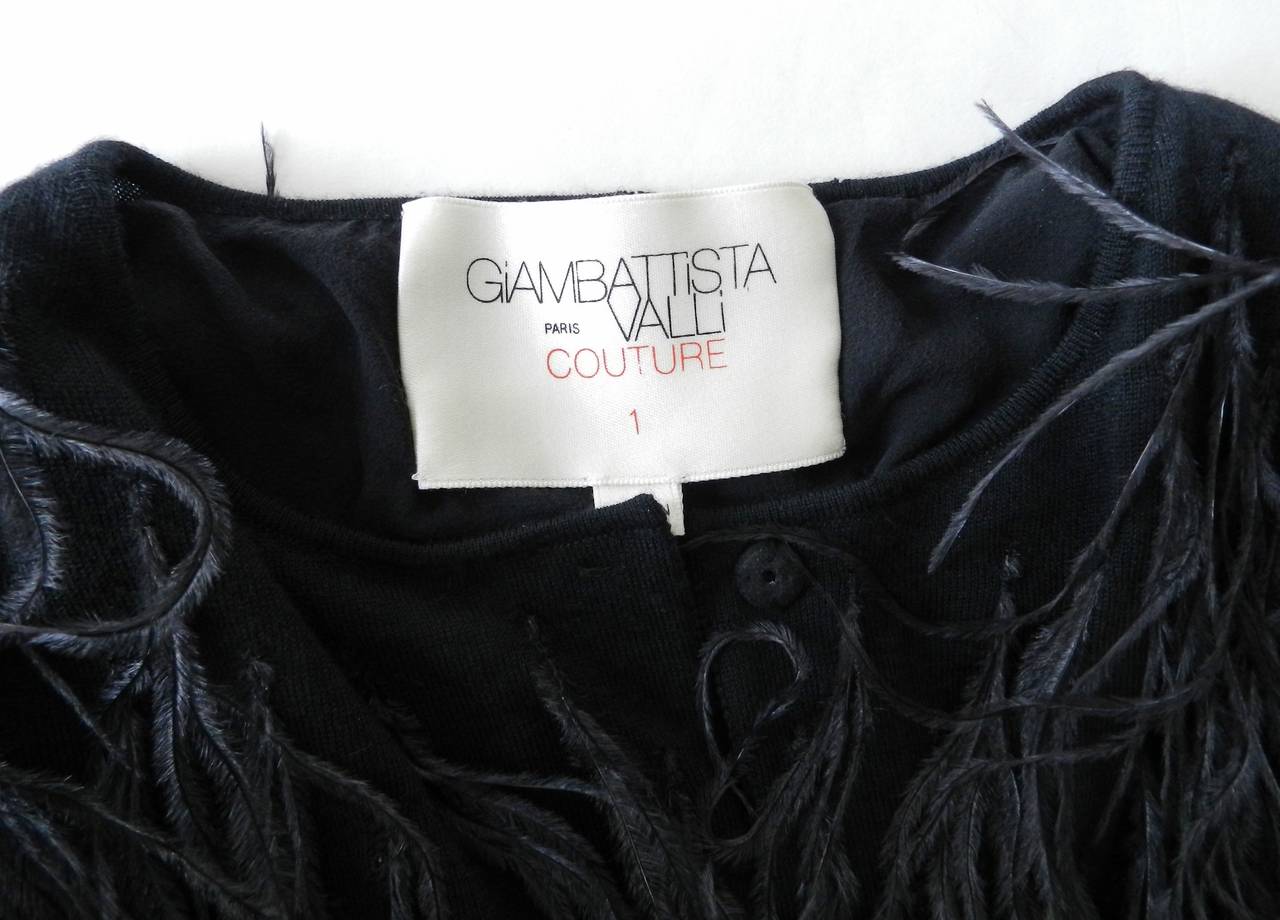 Giambiattista Valli Haute Couture cashmere sweater coat with ostrich feathers. Base is a lightweight cashmere cardigan sweater that is lined in silk and fastens with snaps down the front. Excellent condition - worn once. Spring 2012 collection. Size