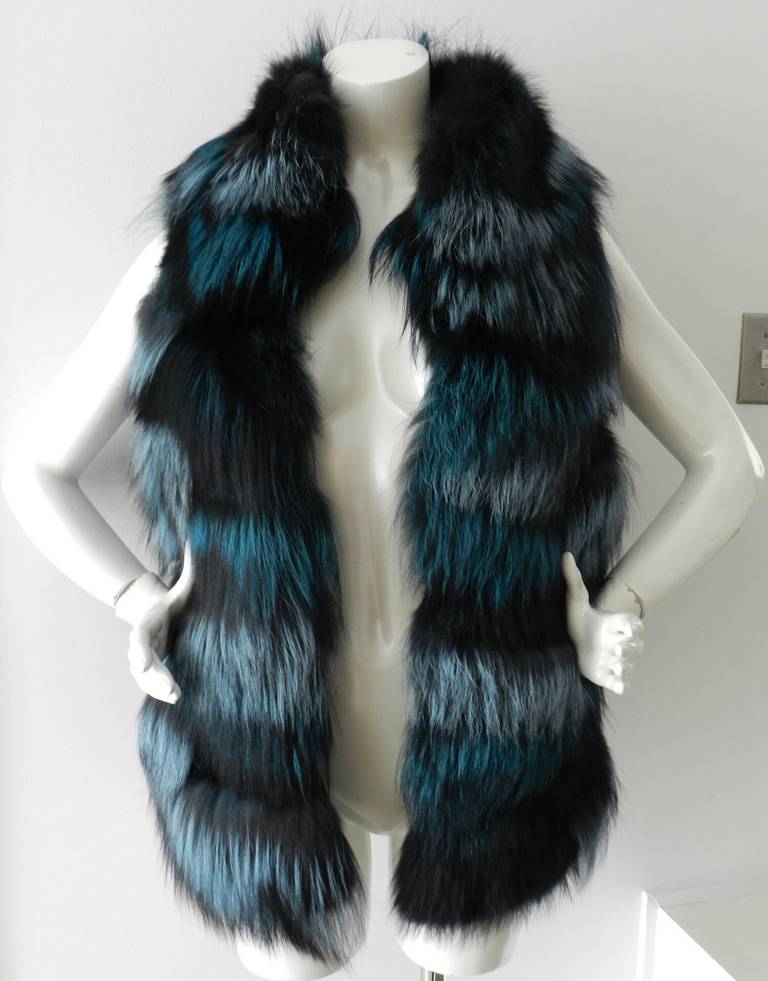 Oscar de la Renta 2013 fall teal dyed fox fur vest. Hidden hook and eye closures down front. Excellent condition - worn once if at all. Tagged size M (USA 6/8). Actual garment bust is 36