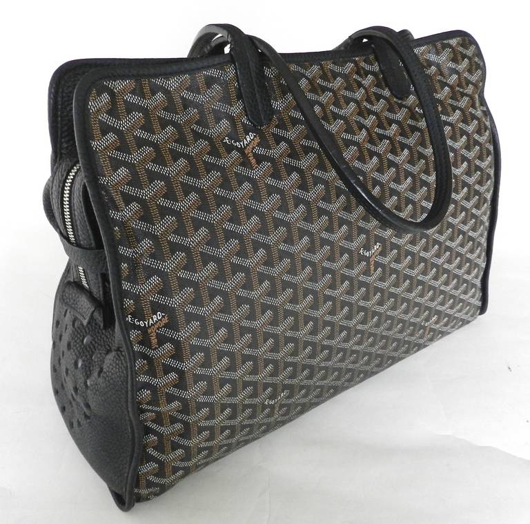 Goyard logo pets bag - purse. Perforated 'Goyard Paris' logo and cat face on sides. Excellent previously owned condition with some marks on interior canvas and light wear along bottom seam of canvas. Body of bag measures 16