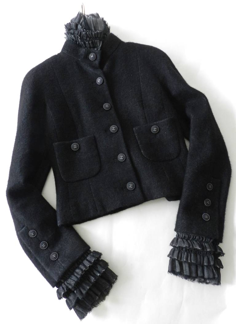 Chanel 2013 black jacket with removable ruffle collar and cuffs. Original price tag of $7175+. Excellent condition - never worn. Tagged size FR 38 (USA 6). Garment bust is 36