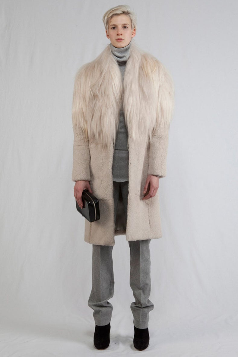 Maison Martin Margiela 2001 pre-fall collection goat hair and sheared rabbit fur coat. Off white color, fastens at front with hidden hook and eye closure, excellent previously owned condition. Tagged size IT 36 (USA 0/2). To fit 32