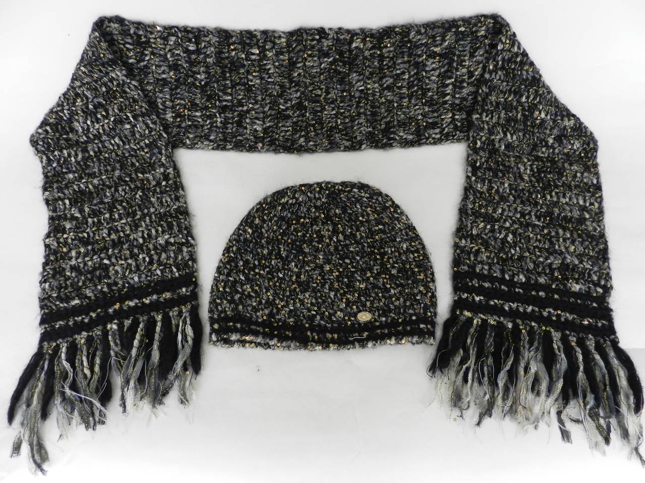 Chanel 2009 Fall/winter scarf and hat set. Main colors are black, greyish taupe, and irridescent gold sequins. Excellent condition. Scarf is 7