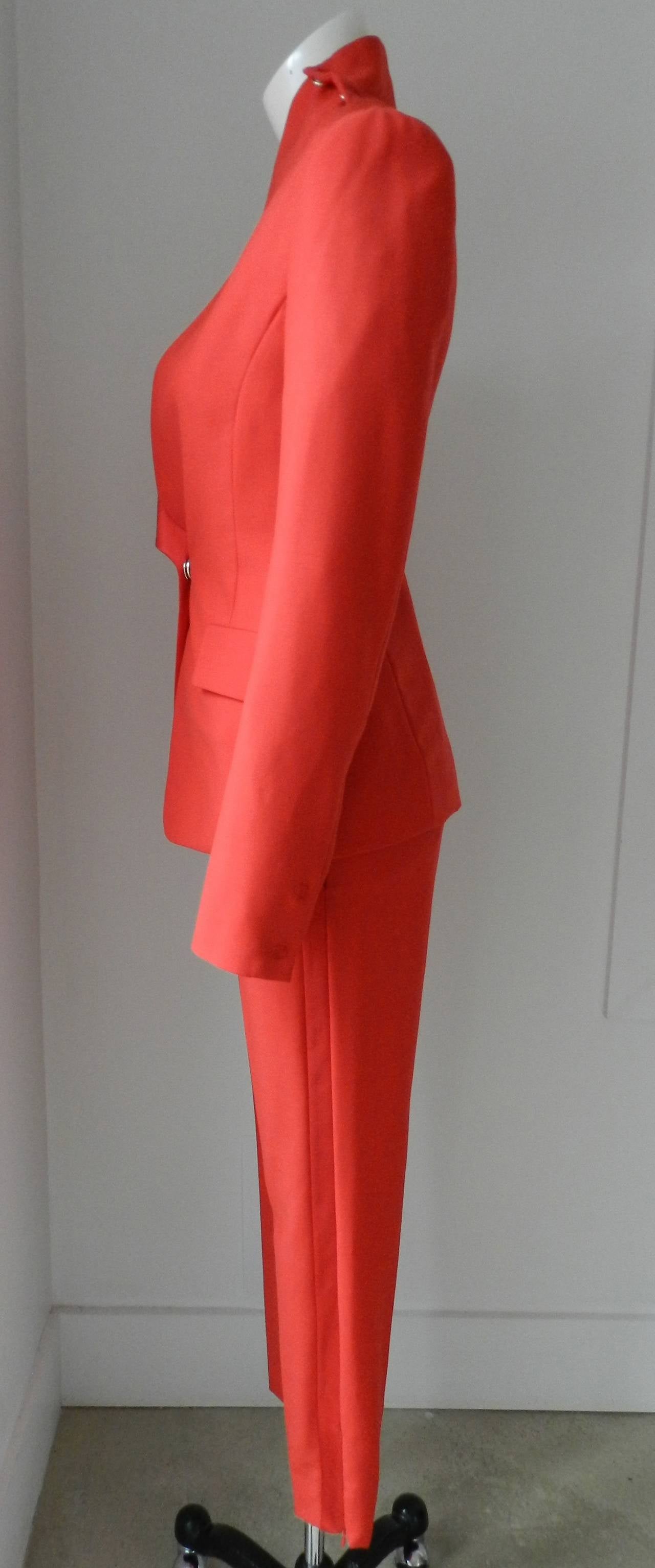 Maison Martin Margiela bright red wool and satin pant suit. 2014. Skinny and cropped low rise trouser pant with hidden ankle zipper. Jacket has a satin collar, and large snap details. Excellent condition - unworn new with tags. Tagged size IT 40