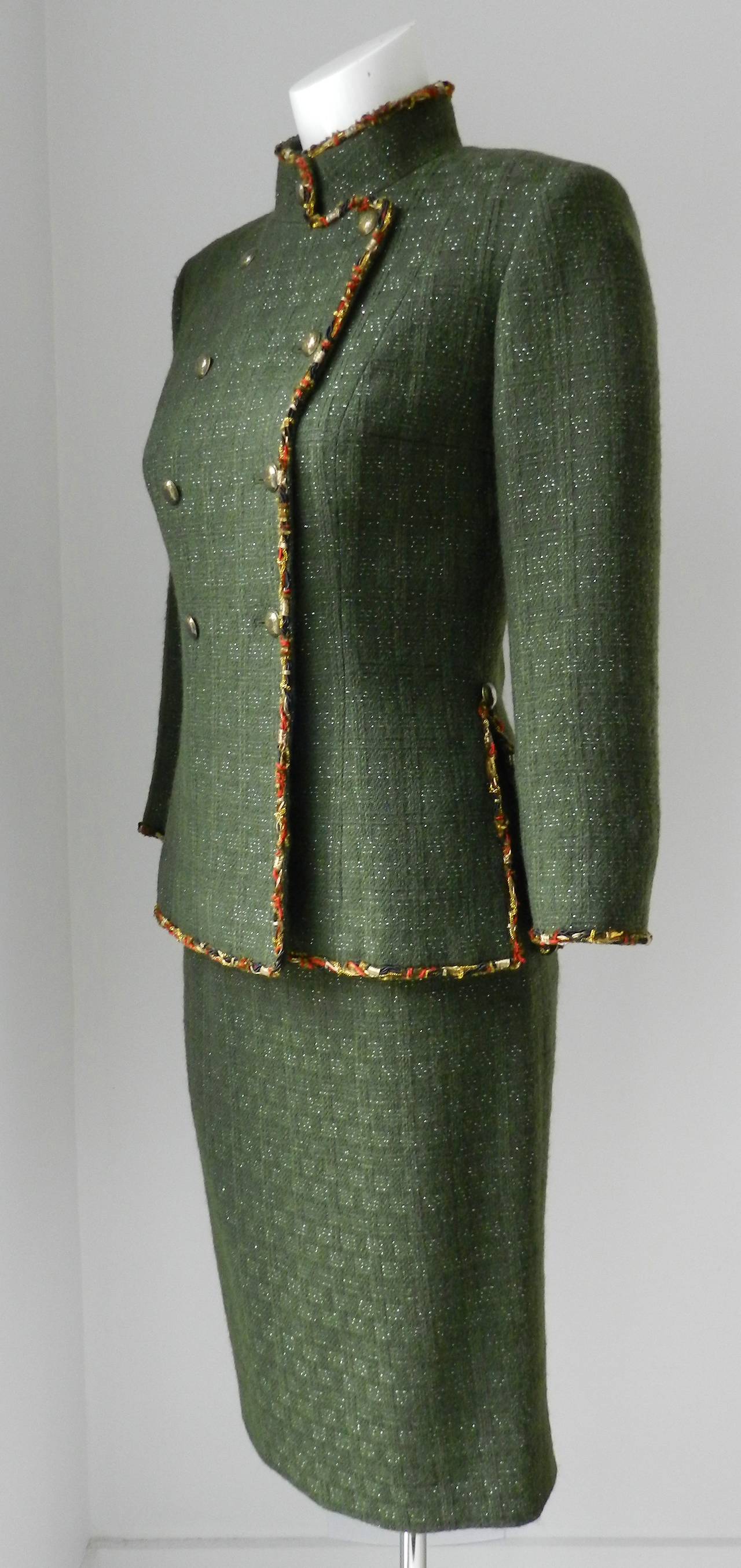 Chanel 2010 pre-fall Shanghai runway collection skirt suit. Dark green with gold/red trim. Enamel round buttons, fitted pencil skirt, high collar. Excellent condition - worn once. Tagged size FR 38 (USA 4/6). To fit 34