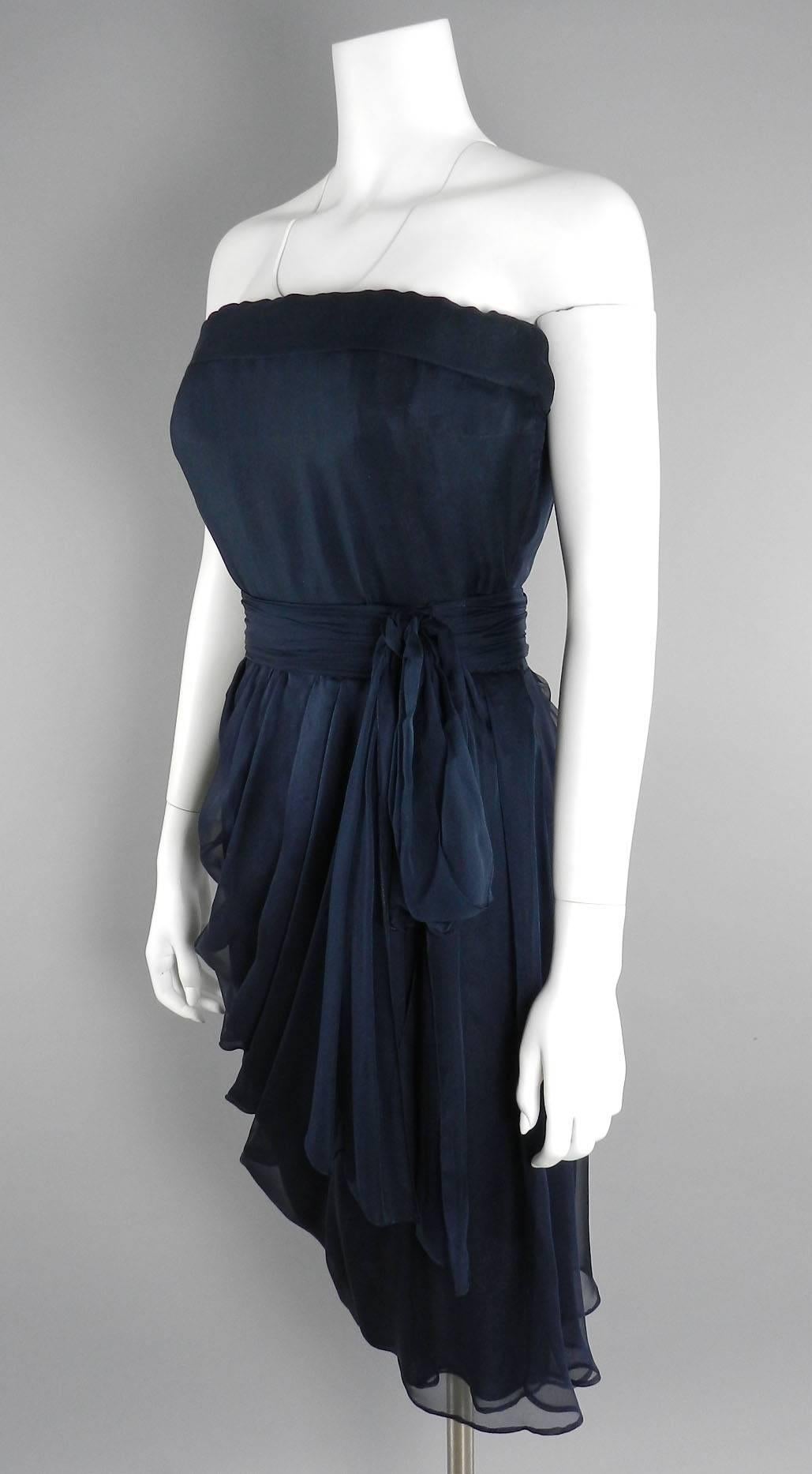 YSL Yves Saint Laurent vintage Haute Couture numbered dress circa 1980's. Black sheer silk chiffon with matching belt. Strapless design, zipper at side. Excellent vintage condition with no flaws to note. Garment designed to fit 36