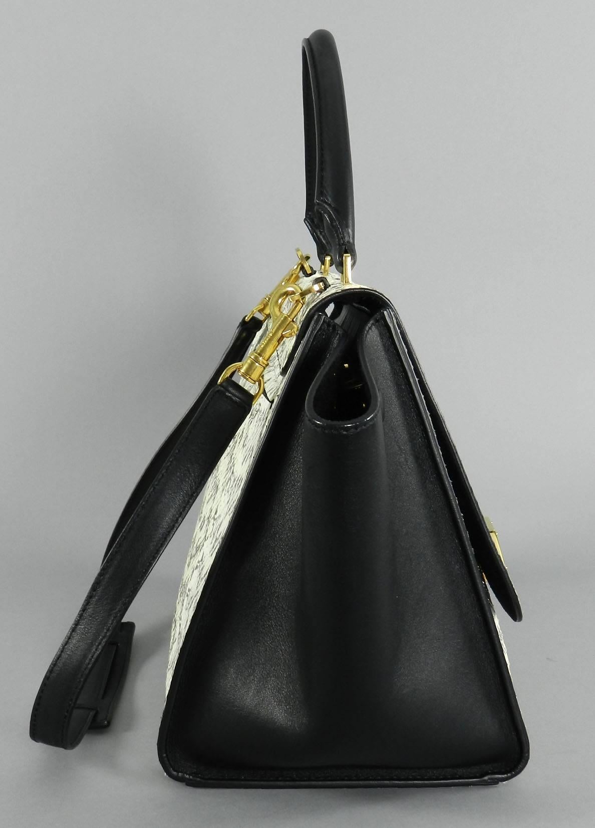 Celine trapeze bag in python snakeskin and black leather. Excellent pre-owned condition. Main body of bag measures 12 x 9 x 7
