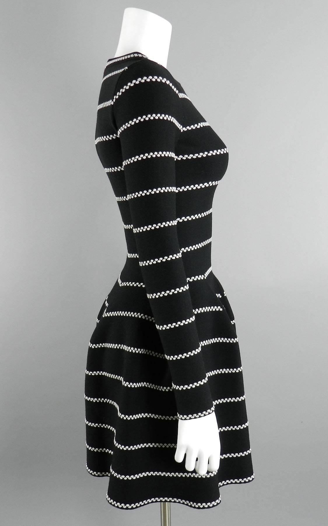 Alaia black and silver striped dress. Excellent pre-owned condition - worn once. Tagged size Alaia 38. Best for a USA 4. Thick stretch knit. Garment will fit a 32-34