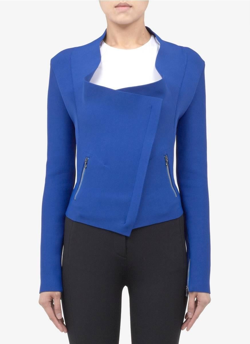 Roland Mouret electric blue solar bandage jacket. Silvertone zippers. Excellent preowned condition - worn once - original price tag of $2380+ is in pocket. Tagged size IT 40, FR 36, USA 4. To fit 34