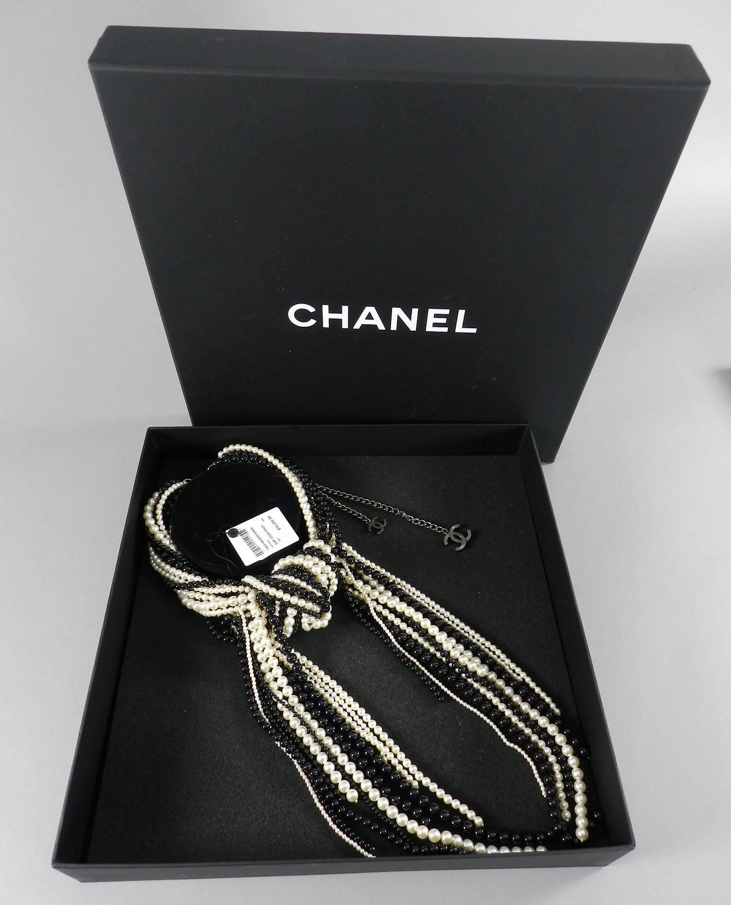 Chanel 2014 fall runway black and pearl bead knot necklace. Brand new in original box with price tag of $10,250+. Measures 15