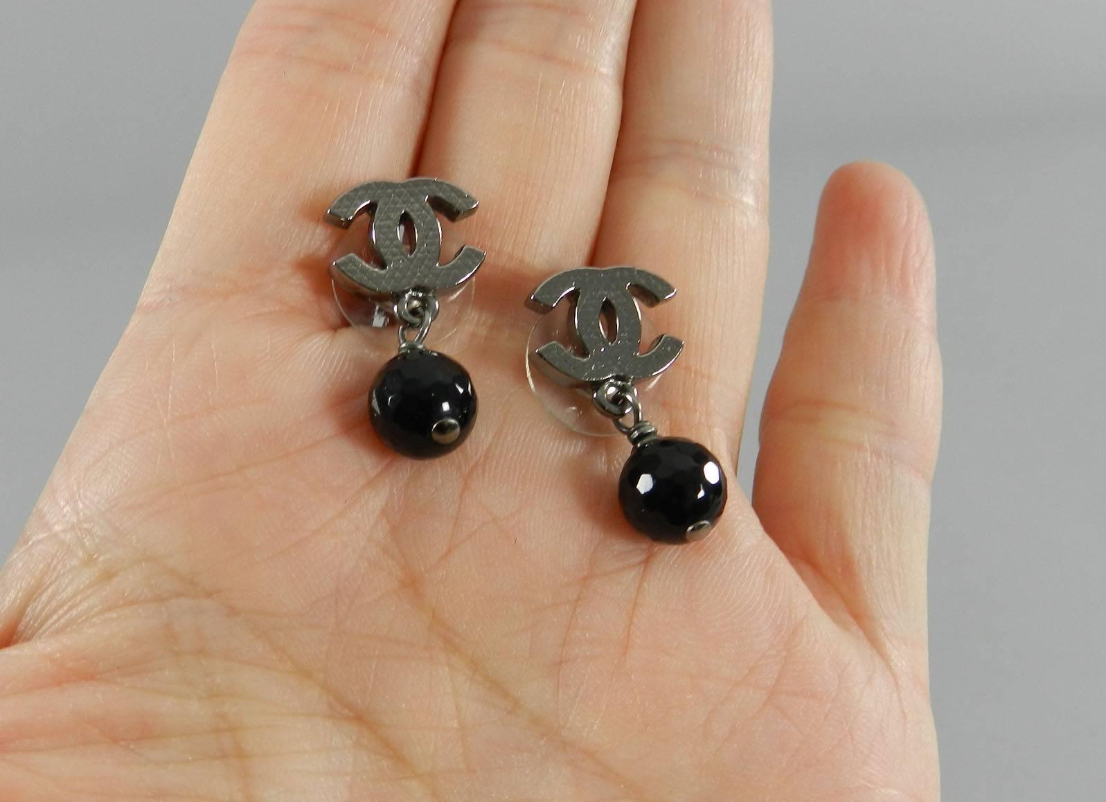 Chanel 10V gunmetal and black bead CC earrings. Pierced. Excellent pre-owned. Measures 0.5