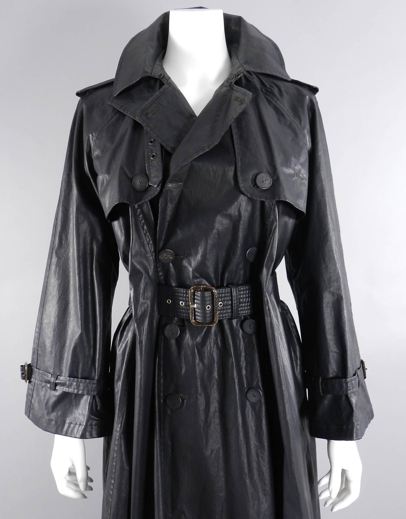 Vintage circa 1990's Jean Paul Gaultier waxed canvas trench coat. Belt weaves through slits / belt-holes in jacket. There are small tears / old repairs on 3 out of 5 of the belt holes. The most damaged one is pictured. Does not detract when worn.