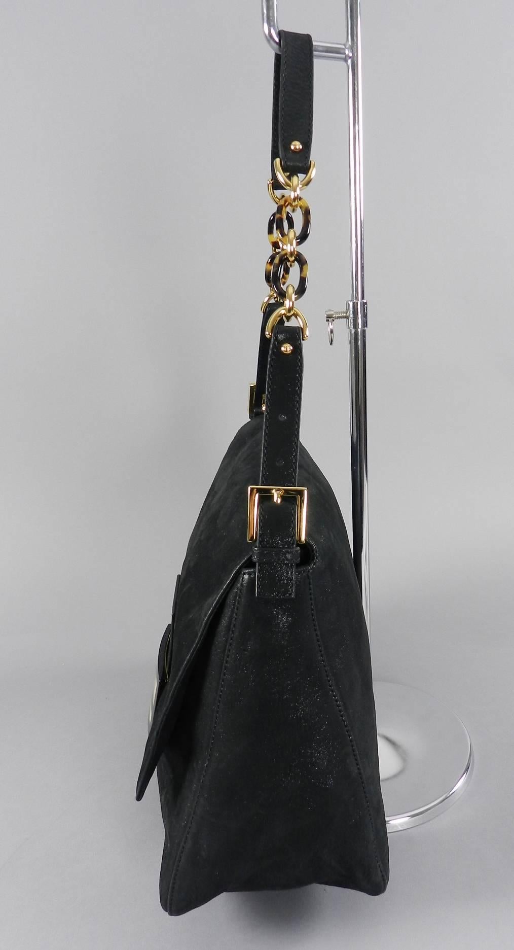 Fendi shimmering black suede Big Mamma shoulder bag with goldtone hardware. Large FF logo resin clasp and faux tortoise link chain. Excellent clean condition – used only once if ever. Original cards and duster.  Body of bag measures 14 x 10 x 5.5”
