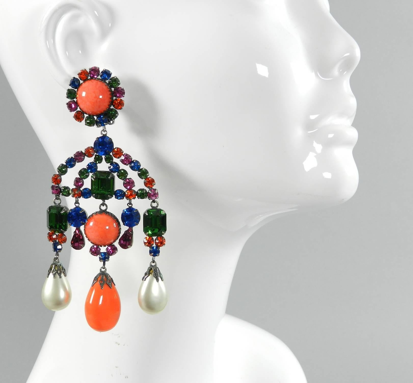 Early Kenneth Jay Lane KJL vintage 1960's large chandelier statement earrings. Clip on. Royal blue, green, orange, and fuchsia rhinestones with coral glass and faux pearls. Set in oxidized silvertone metal. Excellent condition. Measures 4.75