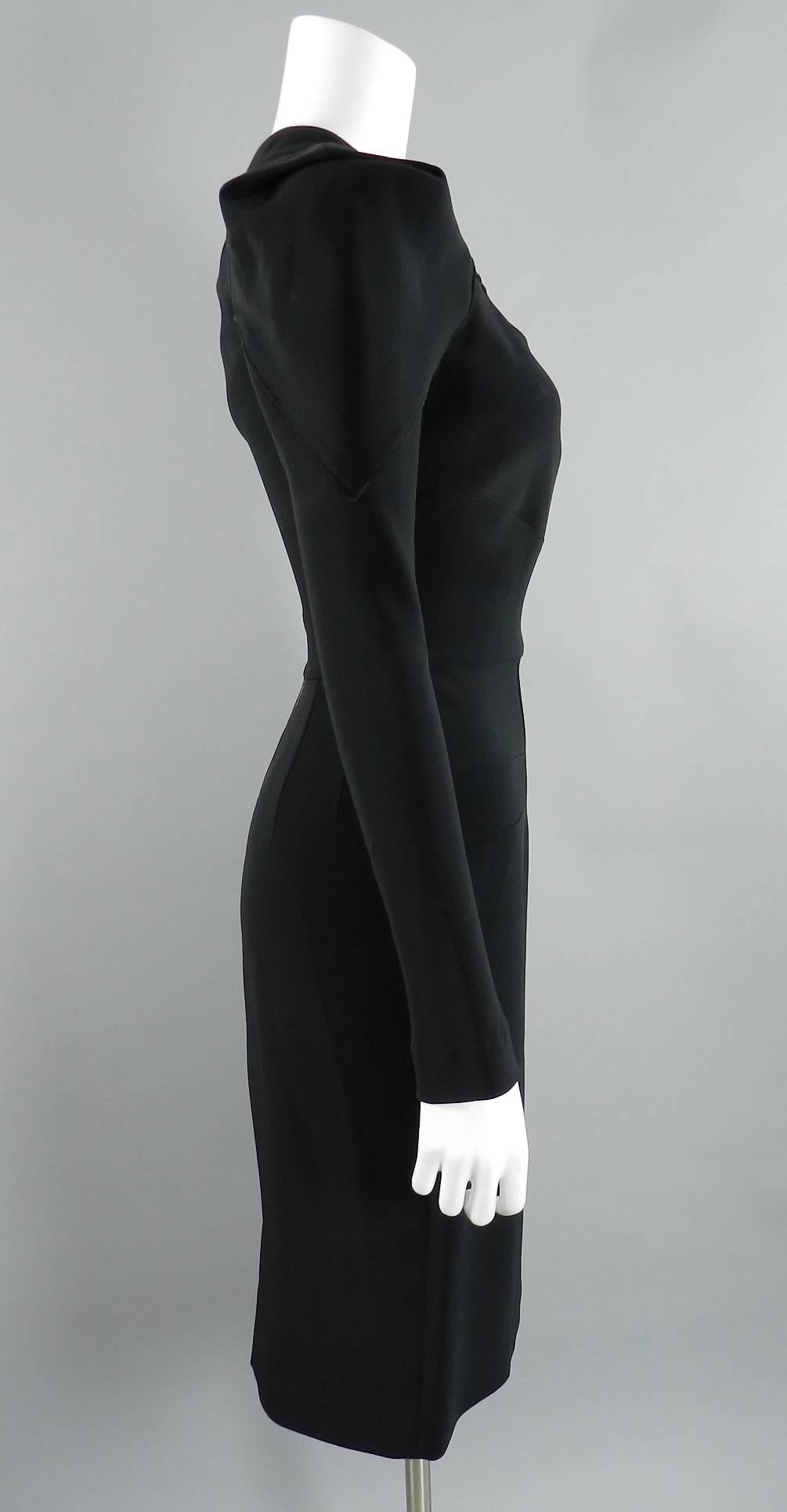 Roland Mouret black crepe long sleeve dress with zipper at back. Excellent pre-owned condition. Tagged size USA 8, Fr 40, IT 44. To fit 35