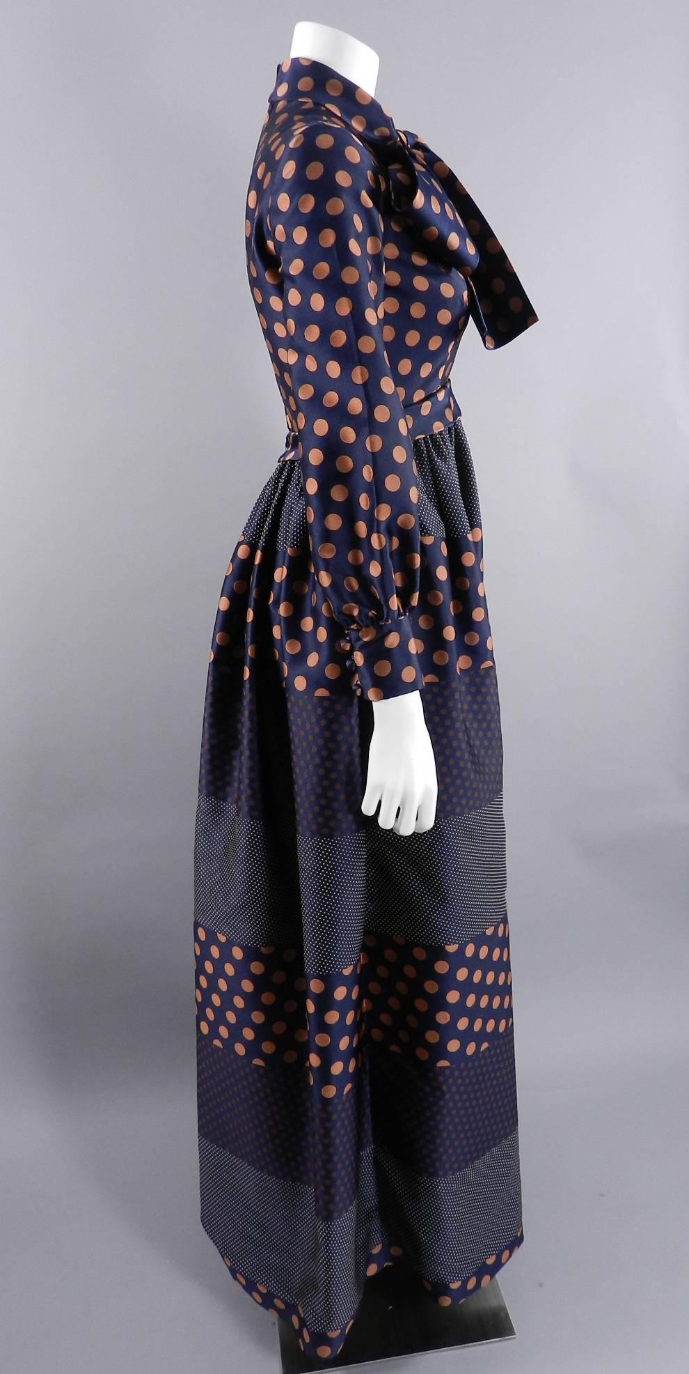 Geoffrey Beene vintage 1970's gown with bow at neck. Polkadots, centre metal back zipper, fitted cuffs fasten with covered buttons. Freshly drycleaned / excellent condition. Approximate size USA 6. Bust to fit 34", raised empire waist is