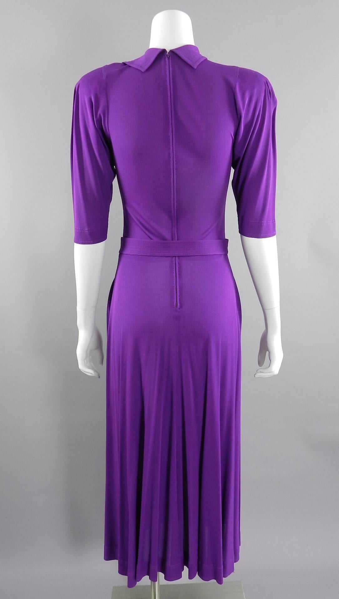 Jean Muir vintage circa 1970's purple jersey dress with belt. 1930's inspired design with pintucked shoulder detail, topstitched collar, centre metal zipper at back. excellent condition - drycleaned. Approximate size USA 6 / 8. To fit 34