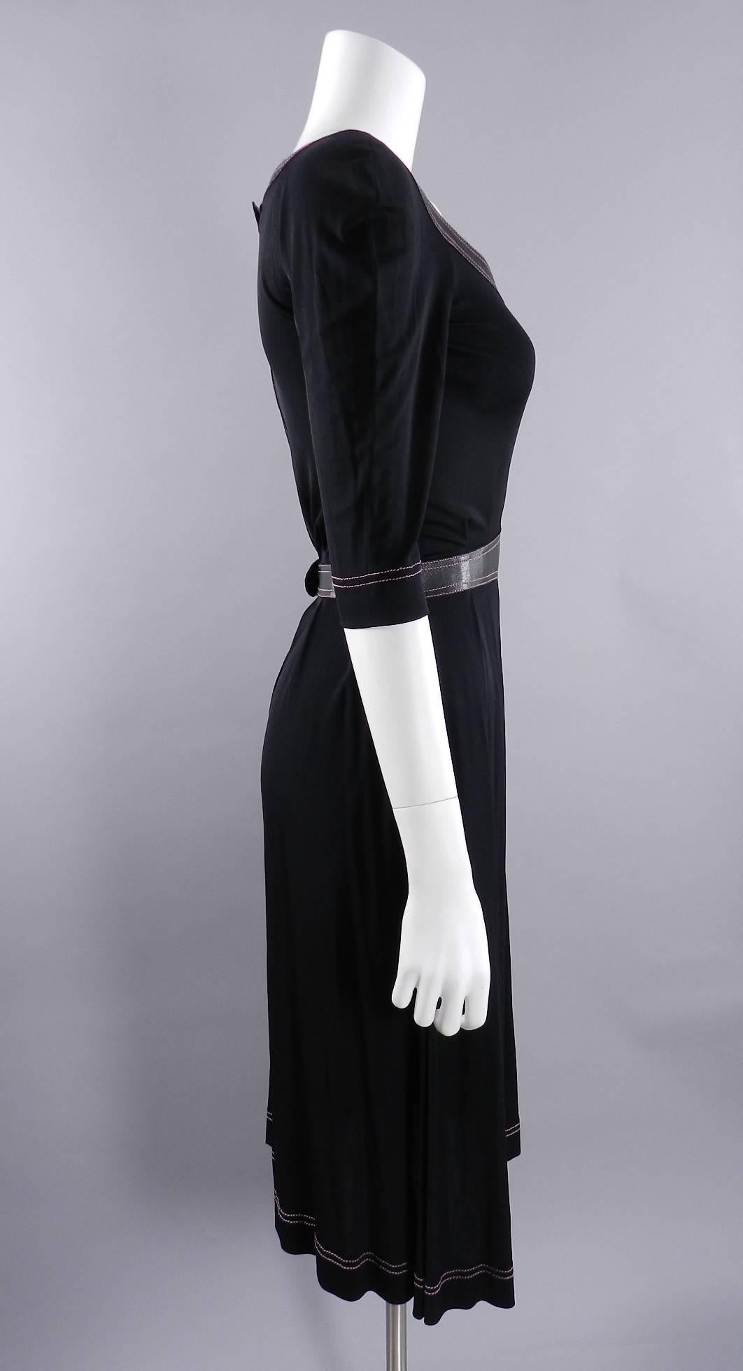 Vintage 1970's Jean Muir black slinky jersey dress with black leather trim and pink top stitching. 100% rayon matte jersey. Centre metal back zipper, no shoulder seams, hidden hip pockets. Overall approximate modern size USA 6/8. To fit 34